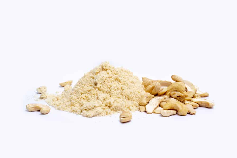 Cashew nut powder is a product derived from cashew kernels and cashew nut fragments that have been cleaned and roasted to make them powder