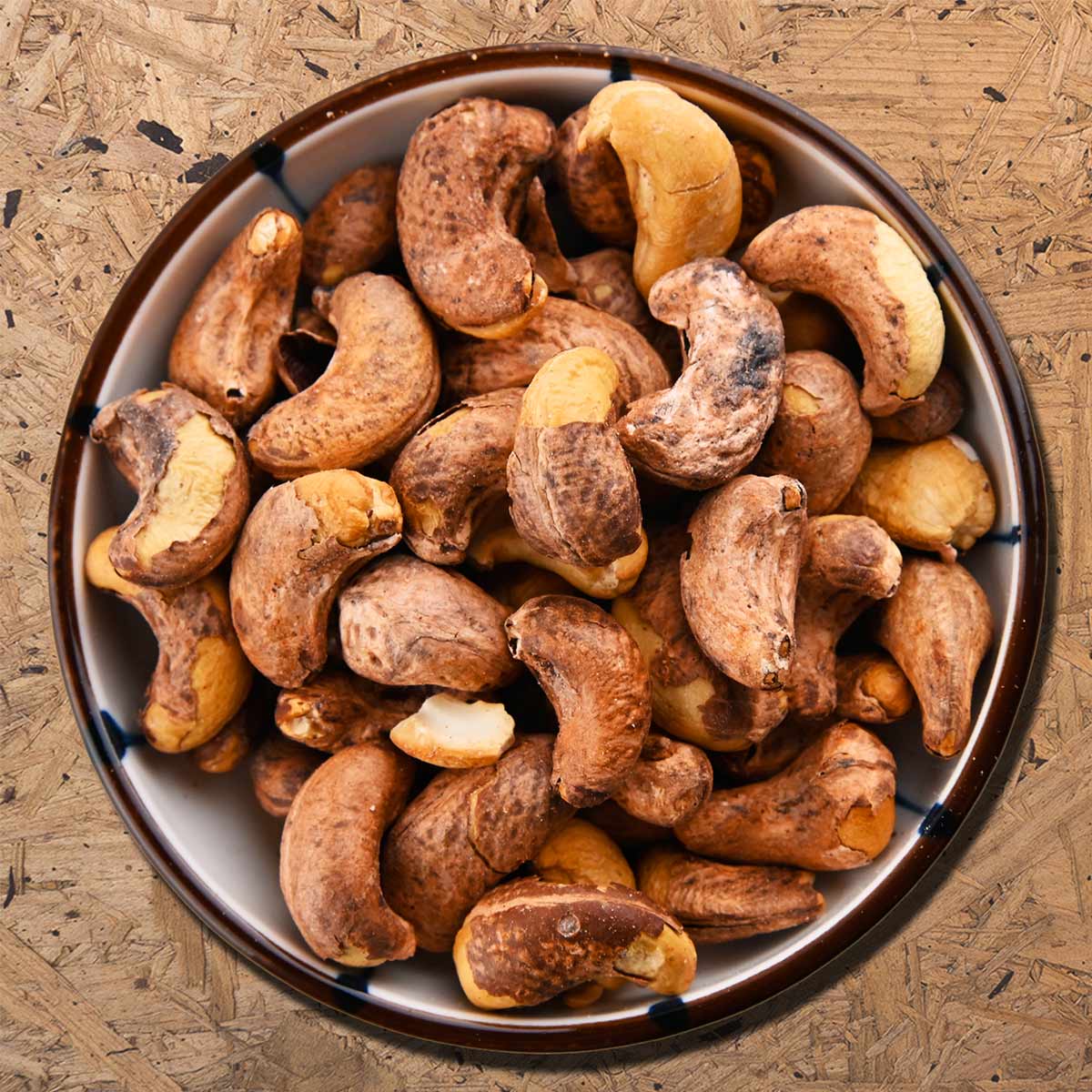 Roasted cashews without salt are the type of cashew kernels that still have Testa skin are roasted with very little salt (about 0.1 - 1% salt)