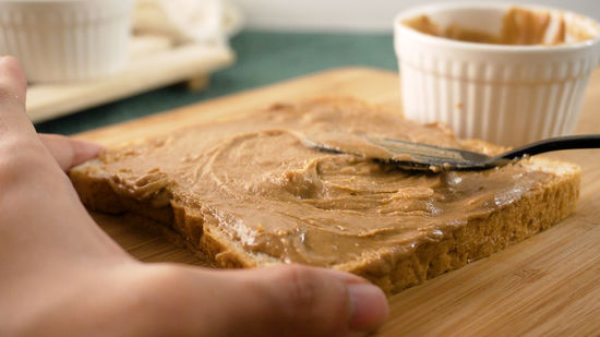 Cashew butter will be served with a sandwich, which is a great breakfast food that provides energy for those on an eat-clean diet.